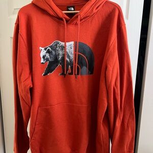 The North Face Men's Red Hoodie with Bear Graphic